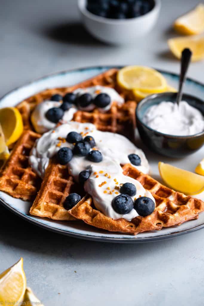 Lemon Blueberry Gluten Free Greek Yogurt Waffles - These gluten free waffles are so crispy and fluffy you will never believe they're low fat, oil free, protein packed and only 170 calories! | #Foodfaithfitness |