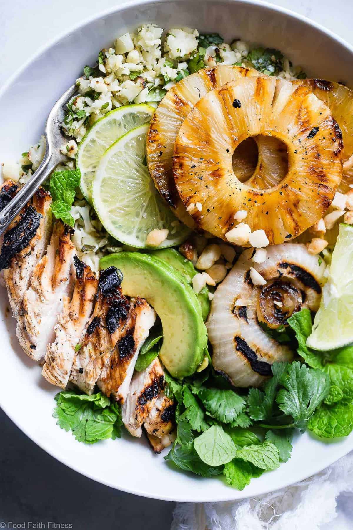 Grilled Tropical Chicken Bowls - These paleo and whole30 compliant Grilled Tropical Chicken bowls are an easy, healthy and gluten free weeknight dinner loaded with sweet and tangy island flavors! Sure to be a crowd pleaser! | #Foodfaithfitness | #Paleo #Whole30 #Glutenfree #Healthy #Chickendinner