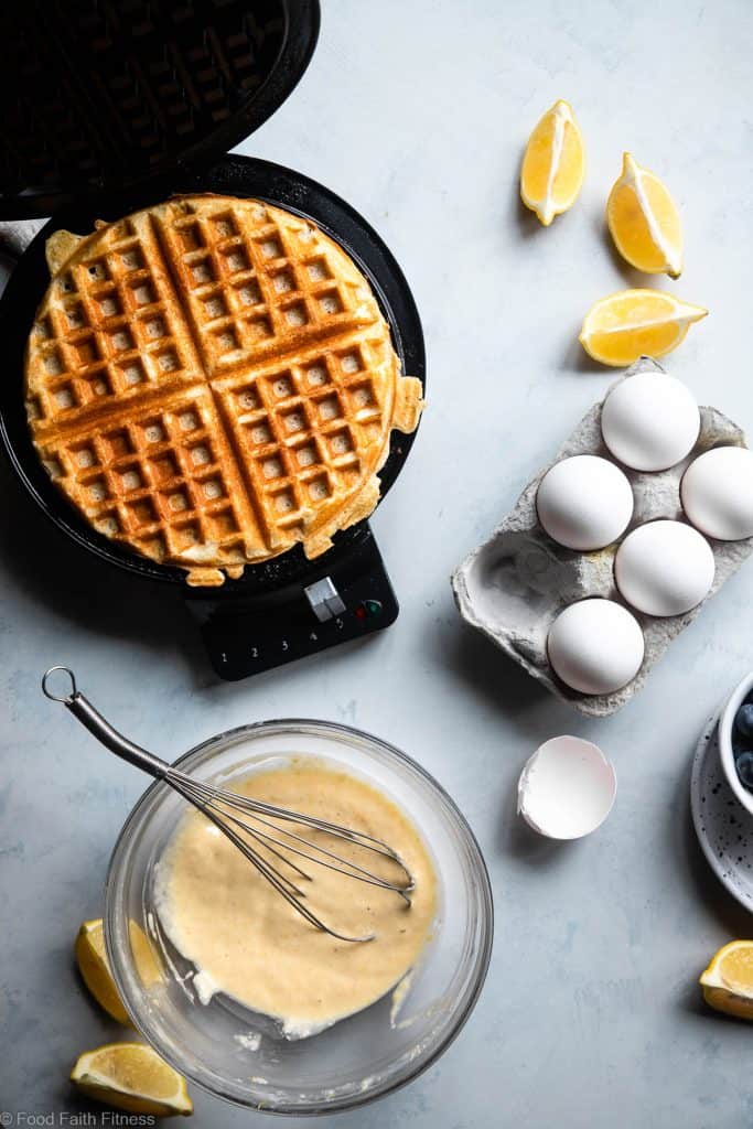Lemon Blueberry Gluten Free Greek Yogurt Waffles - These gluten free waffles are so crispy and fluffy you will never believe they're low fat, oil free, protein packed and only 170 calories! | #Foodfaithfitness |