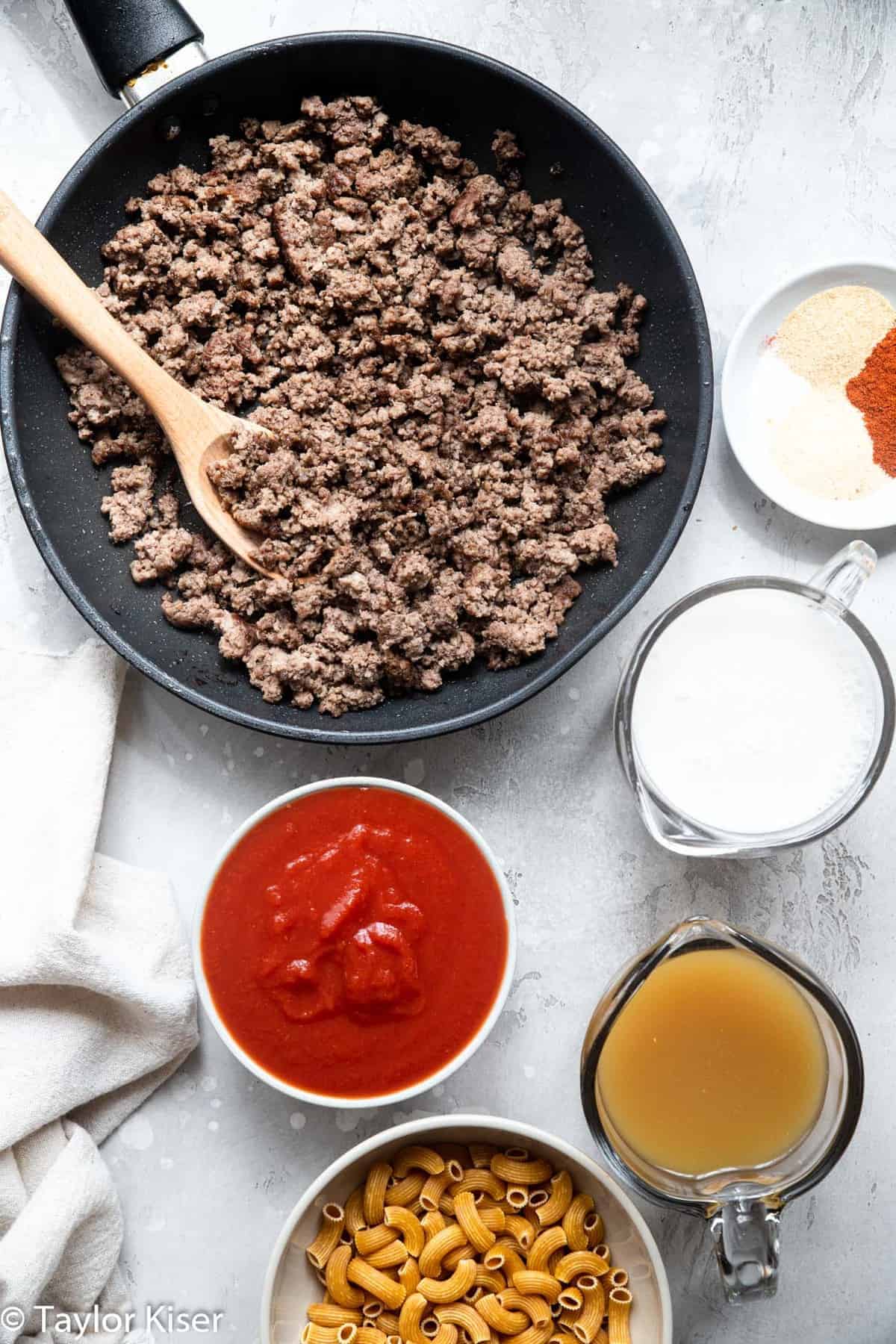 Gluten Free Homemade Healthy Hamburger Helper - A quick and easy, 30 minute meal for busy weeknights! A remake of the boxed version that is naturally gluten free, protein packed and has a dairy free option! Even picky eaters will love it! | #Foodfaithfitness | #Glutenfree #dairyfree #healthy #easydinner #easymeals ingredients to make healthy homemade hamburger helper on a table
